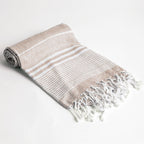 Telo mare beige a righe in cotone